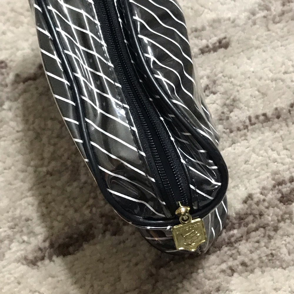 Vintage 90s Lancôme Makeup bag. Black with white stripes Lancôme branded zipper.